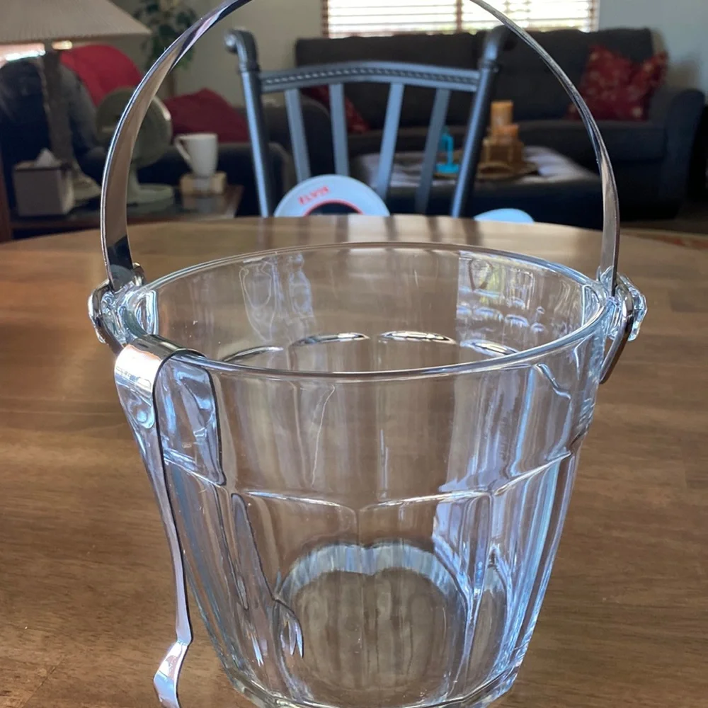 Vintage ice bucket. Mint condition With tongs. 6 3/4 in tall. 7 inches wide.
